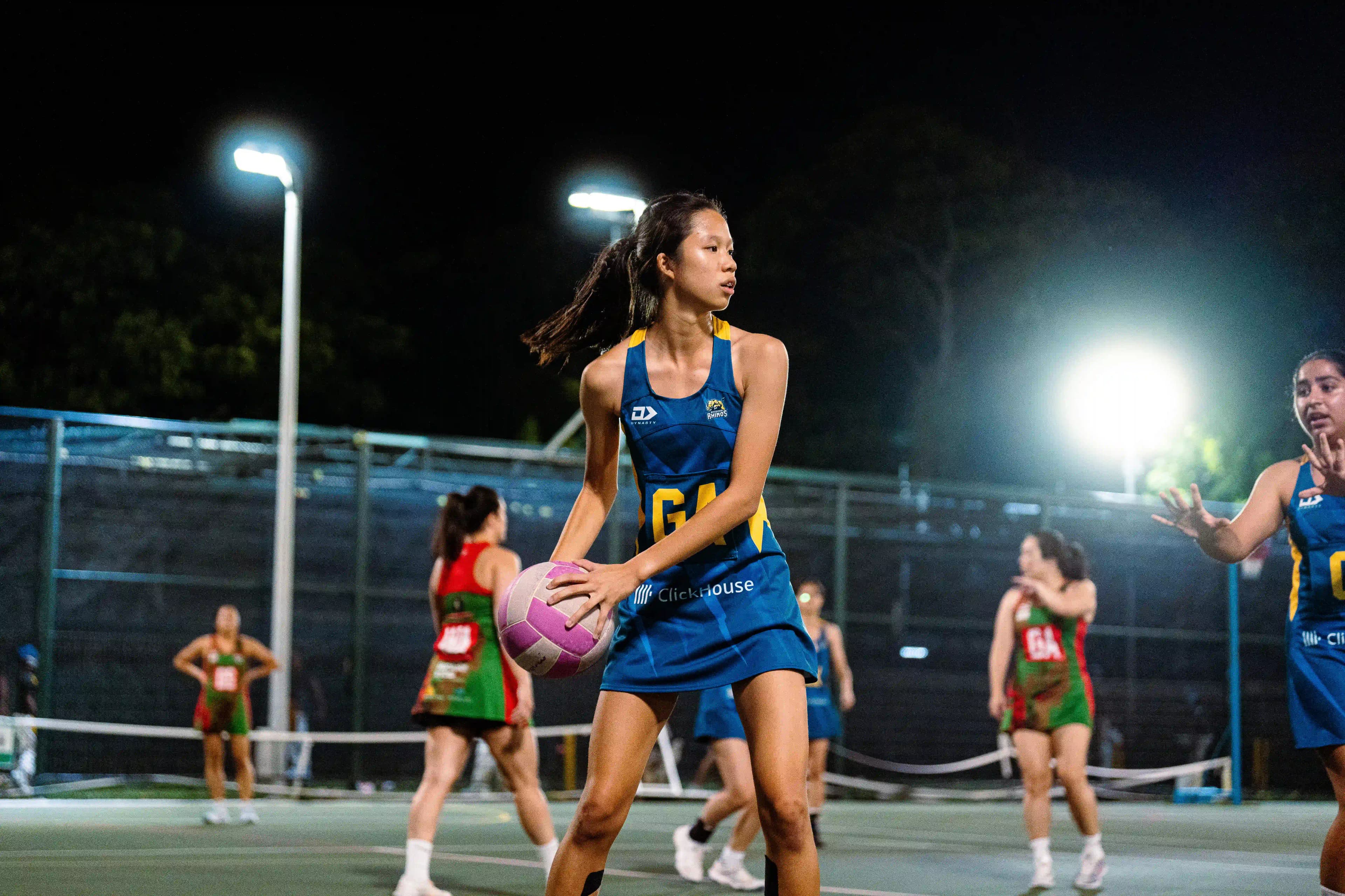 Dauntelica Rhinos Goal Attack player seeking an opening under stadium lights