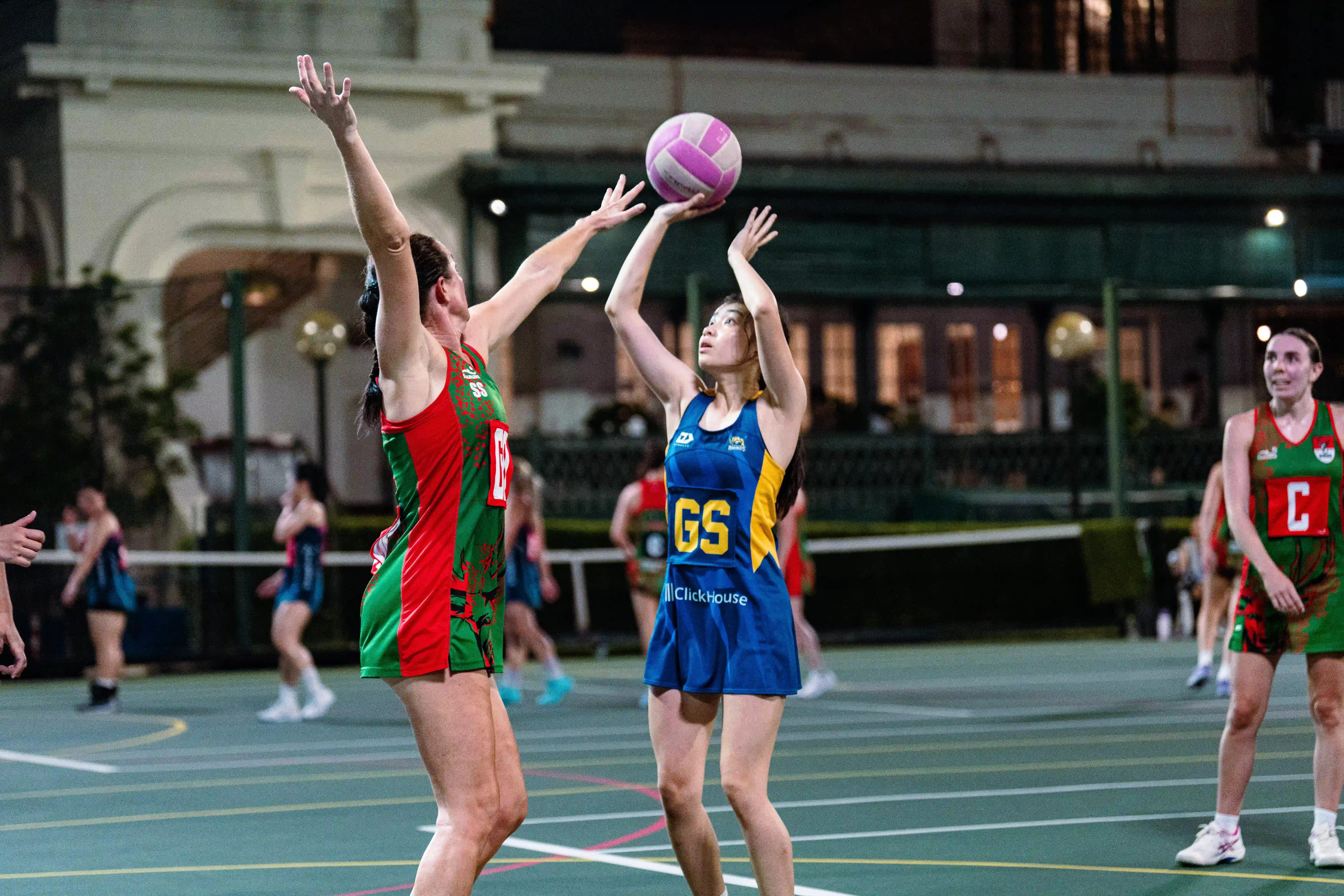 Rhinos Goal Shooter elevating for a shot against opposition defense